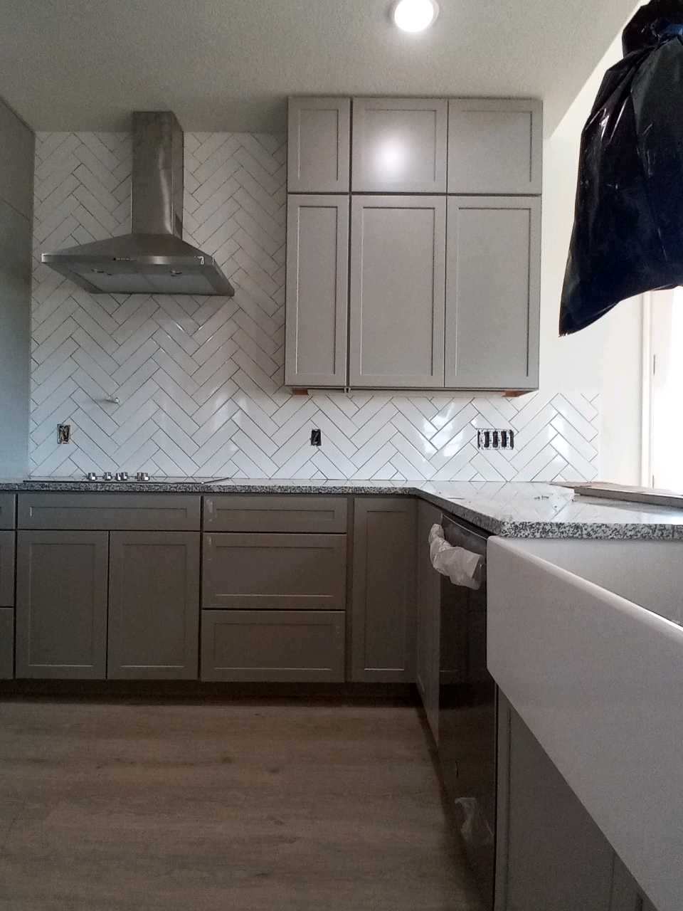 herringbone style backsplash in kitchen, wfa's custom hardwood floors, houston texas